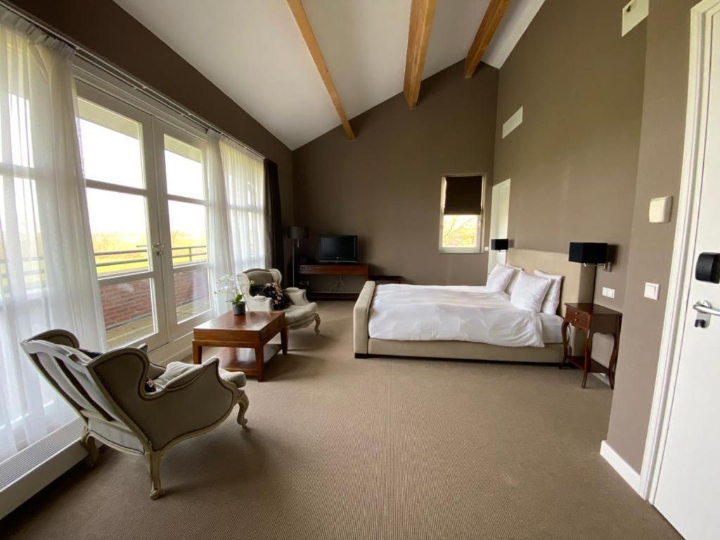 Landhotel De Ijsvogel Sint Nicolaasga ภายนอก รูปภาพ